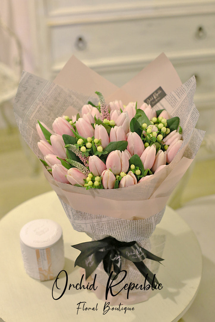 Blush pink tulip and veronica bouquet with creamy white hypericum berries