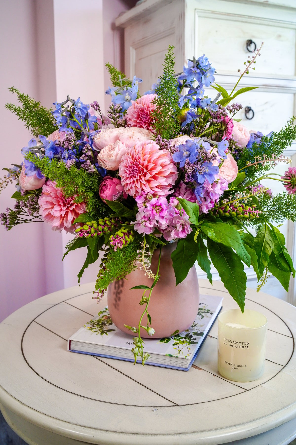 Close-up of blush dahlias, spray roses, lavender stock and purple limonium