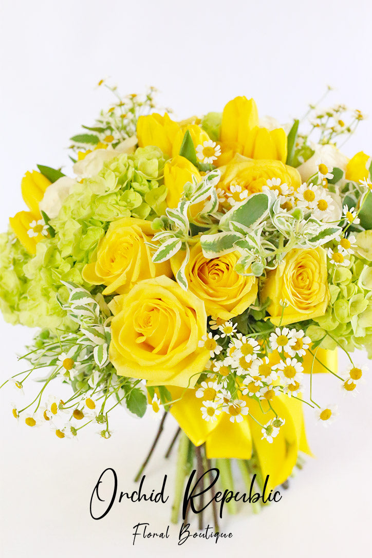 Close-up of roses, tulips and hydrangeas mixed with refreshing green foliage