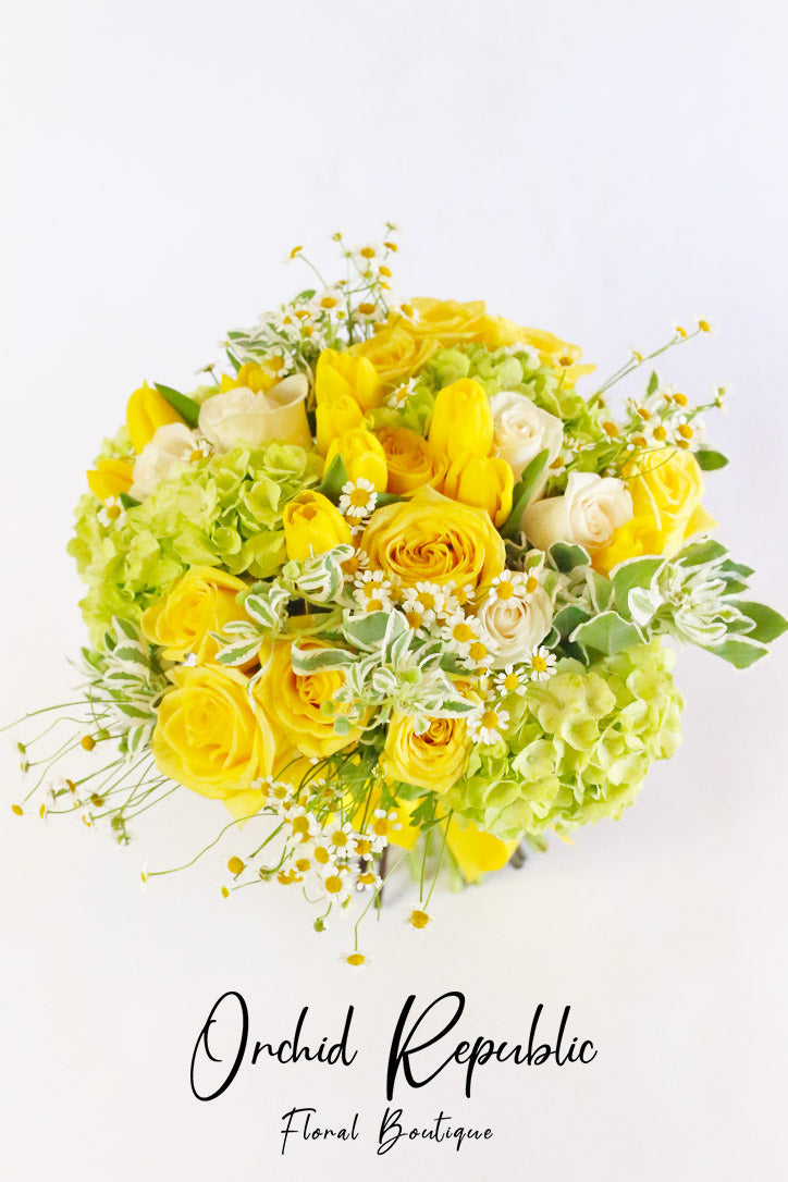 Close-up of roses, tulips and hydrangeas mixed with refreshing green foliage