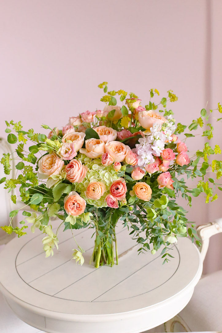 Juliet garden rose bouquet finished with gunni eucalyptus, pittosporum and lush greenery